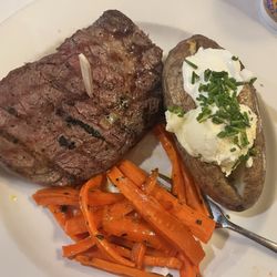 The Oaks Restaurant - 14 ounce ribeye with sugar, carrots, and loaded, baked potato