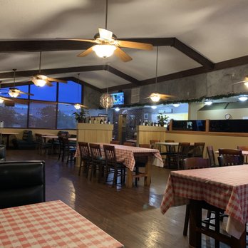 Ellinya Italian - a dining room with a ceiling fan - Italian Near Me - Corsicana, Texas Ellinya Italian - a dining room with a ceiling fan - Italian Near Me - Corsicana, Texas