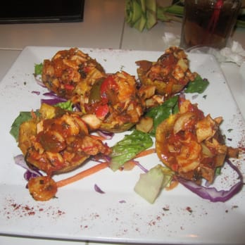 Luquillo Kiosks - Seafood stuffed Plantain basquets (plantain mini basquets full of cconch, octopus, shrimp with creole sauce)-- at Congas - Seafood Near Me - Luquillo, Puerto Rico Luquillo Kiosks - Seafood stuffed Plantain basquets (plantain mini basquets full of cconch, octopus, shrimp with creole sauce)-- at Congas - Seafood Near Me - Luquillo, Puerto Rico