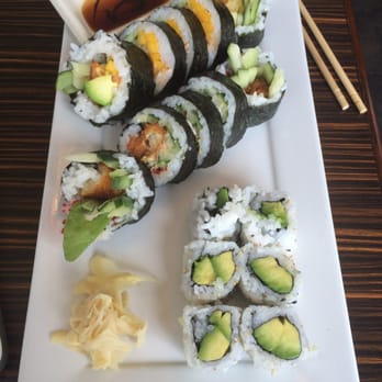 Tora Sushi - a plate of sushi and chopsticks - Sushi Bars Near Me - Montreal, Quebec Tora Sushi - a plate of sushi and chopsticks - Sushi Bars Near Me - Montreal, Quebec