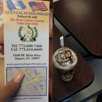 Quetzal Super Bread - a hand holding a menu - Cuban Near Me - Stuart, Florida