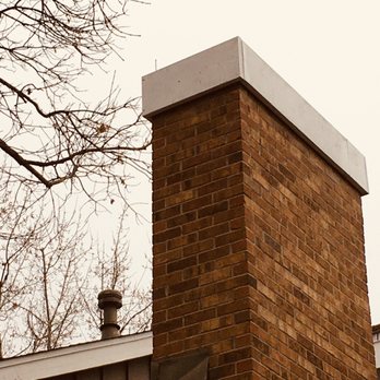 MITM - a brick chimney on a house - General Contractors Near Me MITM - a brick chimney on a house - General Contractors Near Me