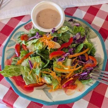 Pinocchio's - House garden salad. I already took a couple bites before taking this photo - Italian Near Me - Longmont, Colorado Pinocchio's - House garden salad. I already took a couple bites before taking this photo - Italian Near Me - Longmont, Colorado