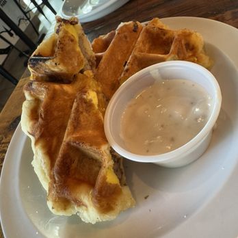 Just Love Coffee Cafe - Clermont - Sausage Egg & Cheese Biscuit made as a waffle, with gravy dip! It was fun and delicious! - Breakfast & Brunch Near Me - Clermont, Florida Just Love Coffee Cafe - Clermont - Sausage Egg & Cheese Biscuit made as a waffle, with gravy dip! It was fun and delicious! - Breakfast & Brunch Near Me - Clermont, Florida