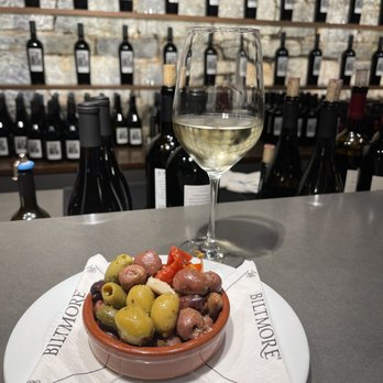 Biltmore Winery - Olives and white wine at the wine bar. - Wineries Near Me - Asheville, North Carolina