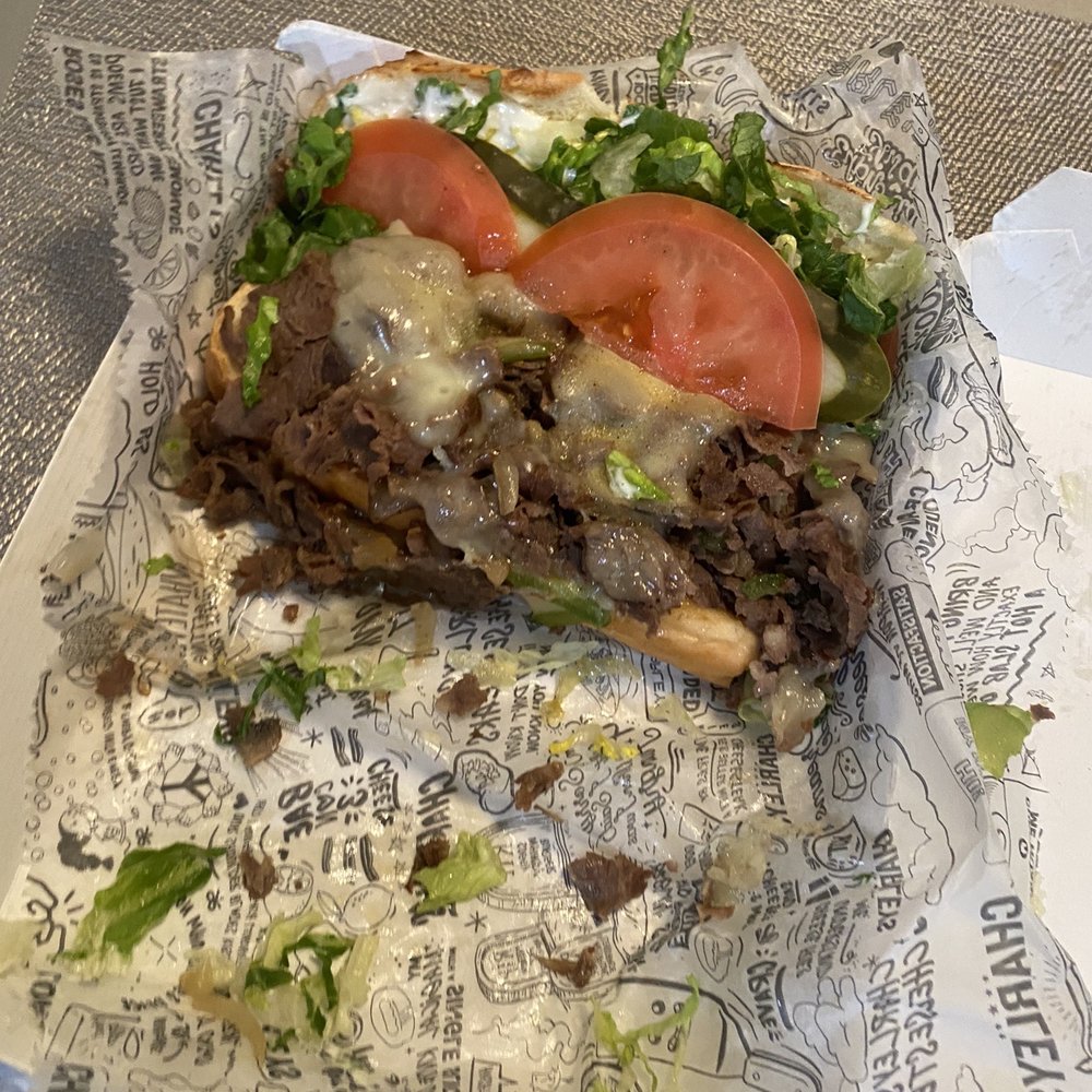 Charleys Cheesesteaks - Philly Steak Cheesesteak Boxed Meal. They pile on the meat. Not skimpy at all  Cheese fries (not pictured) were in a separate box - Cheesesteaks Near Me - Palos Hills, Illinois