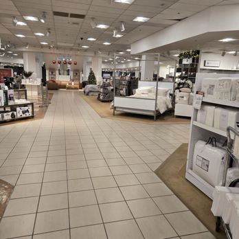 Macy's - A department store interior with bedding, home decor, and appliance displays, featuring tiled flooring and ceiling lights. - Department Stores Near Me - Carlsbad, California
