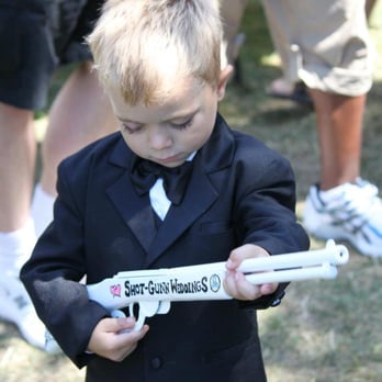 Shot-Gunn Weddings - A little participant at a wedding saw the prop gun and instantly wanted to play lol - Wedding Planning Near Me