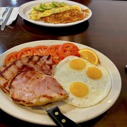 All Star Burgers Cafe - Ham, eggs and sliced tomatoes. And Vegetarian cheese omelette with avocado, tomatoes, mushrooms cheddar/jack cheese and onions.