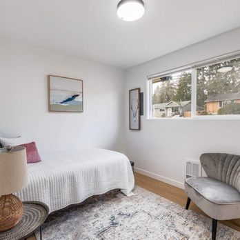 Vasa Construction - a bedroom with a bed and a chair - Roofing Near Me - Seattle, Washington Vasa Construction - a bedroom with a bed and a chair - Roofing Near Me - Seattle, Washington