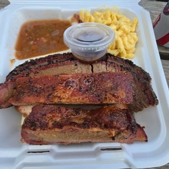Bird’s Barbecue - 3 meat plate.  Beans Mac and cheese Brisket Ribs Underneath it all is smoked turkey - Barbeque Near Me - Bellville, Texas