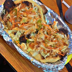 El Guanaco Bakery & Café - Papusas con chicharrón y queso