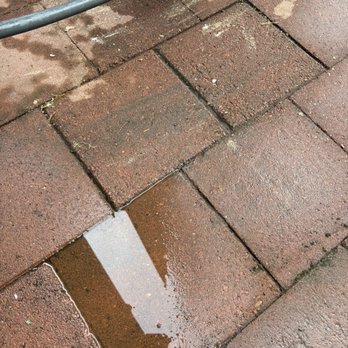 Evolution Home Improvement - Standing water and flipped uneven pavers. - Handyman Near Me Evolution Home Improvement - Standing water and flipped uneven pavers. - Handyman Near Me