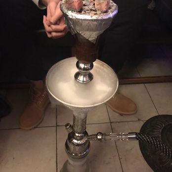 Mediterranea - a person sitting on a couch with a glass of ice cream - Middle Eastern Near Me - New Haven, Connecticut