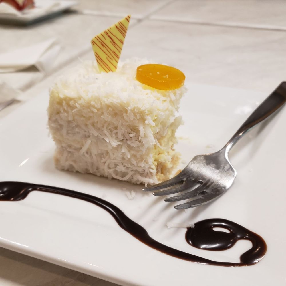 Dulce Cafe - Gluten free coconut cake (partially eaten, haha) - Coffee & Tea Near Me - Durham, North Carolina Dulce Cafe - Gluten free coconut cake (partially eaten, haha) - Coffee & Tea Near Me - Durham, North Carolina