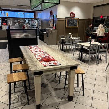 Chick-fil-A - ows a table and chairs in a restaurant - Salad Near Me - Grand Rapids, Michigan
