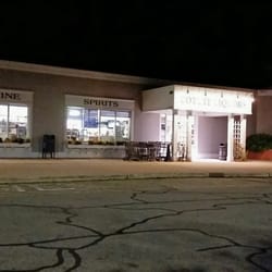 Cotuit Liquors - Storefront at night