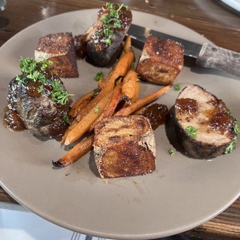 Woodside Grill - Caramelized glazed Pork tenderloin & carrots with a chutney sauce. - Bars Near Me - Anderson, California Woodside Grill - Caramelized glazed Pork tenderloin & carrots with a chutney sauce. - Bars Near Me - Anderson, California