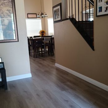 Carlos Mercado Flooring - a living room and dining room - Flooring Near Me