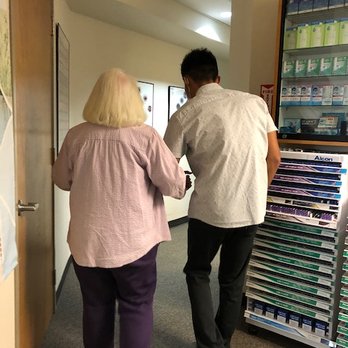 Capitol Optometry - their summer intern, Thai (sp?), carefully escorting my 94 yr old mother to the exam room (she needs help walking). - Optometrists Near Me - Sacramento, California