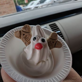 Sweet Sensations - a hand holding a paper plate with a ghost on it - Ice Cream & Frozen Yogurt Near Me - Holt, Michigan Sweet Sensations - a hand holding a paper plate with a ghost on it - Ice Cream & Frozen Yogurt Near Me - Holt, Michigan