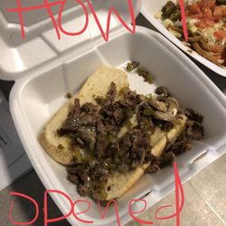 Sports & Spirits - Philly beef steak sandwich. This is how I opened it when I got home (a few min from location). It's just "meat" and some mushrooms.