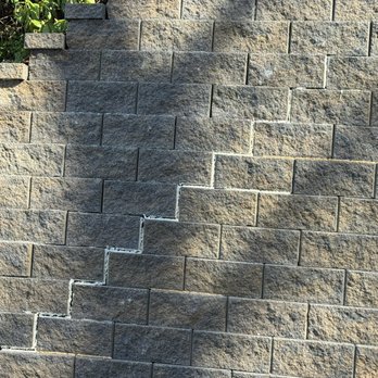 Outdoor Experts - Lower wall with "repair". - Landscaping Near Me Outdoor Experts - Lower wall with "repair". - Landscaping Near Me