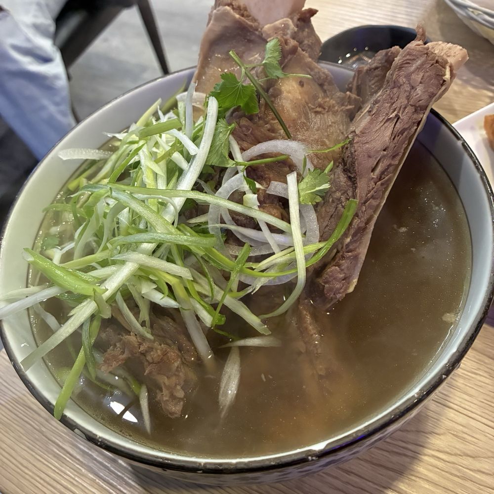 Pho Lab - Pho Rib Bone (10-hour plus simmered beef bone broth, rice noodles topped with green onions, white onions, & cilantro - $14.95) - Vietnamese Near Me - Huntington Beach, California Pho Lab - Pho Rib Bone (10-hour plus simmered beef bone broth, rice noodles topped with green onions, white onions, & cilantro - $14.95) - Vietnamese Near Me - Huntington Beach, California