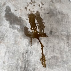 Jiffy Lube - Oil that should have been in the car not on the garage floor.