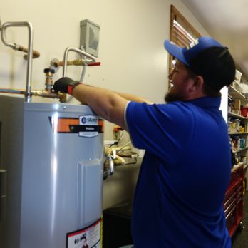 The Problem Solvers - Our Plumber Jeshua working on a tank style water heater. - Heating & Air Conditioning/HVAC Near Me - San Antonio, Texas