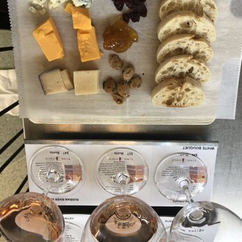 Vino Volo - a variety of cheeses and wine glasses - Wine Bars Near Me - Milwaukee, Wisconsin
