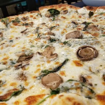 The Roman Oven - White pizza with spinach and mushrooms - Italian Near Me - Braselton, Georgia The Roman Oven - White pizza with spinach and mushrooms - Italian Near Me - Braselton, Georgia