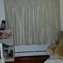 World of Windows - This bedroom's curtains were left hanging, and the screens were not uninstalled. Dirty red rag on the floor.