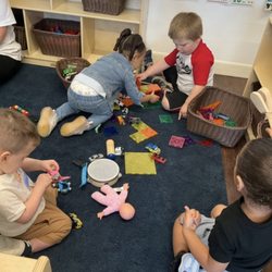 Tiny Hands Enrichment Center - Free play with friends in block area.