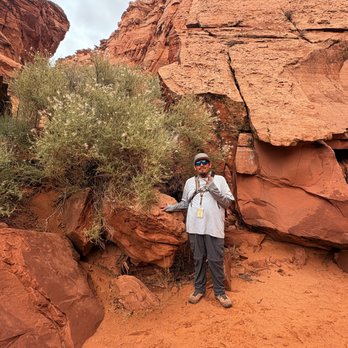 Taadidiin Tours - Garrett showing us the rock formation of a turtle - Walking Tours Near Me - Page, Arizona Taadidiin Tours - Garrett showing us the rock formation of a turtle - Walking Tours Near Me - Page, Arizona