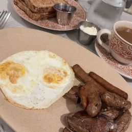 Classic breakfast, over medium eggs were obviously overcooked, small portion of potatoes and sausage. Burnt coffee. Classic breakfast, over medium eggs were obviously overcooked, small portion of potatoes and sausage. Burnt coffee.
