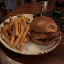 Beer battered fried haddock sandwich with red cabbage slaw, tartar sauce, and fries Beer battered fried haddock sandwich with red cabbage slaw, tartar sauce, and fries