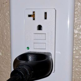 A GFCI outlet was installed where there should have been one, but was initially just a standard outlet (wiring was already in the wall).