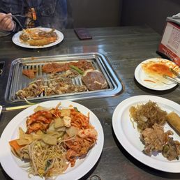 Assorted banchan and grilling Beef Bulgogi and Spicy Pork Bulgogi. Egg toll anf Japchae (Glass Noodle) Assorted banchan and grilling Beef Bulgogi and Spicy Pork Bulgogi. Egg toll anf Japchae (Glass Noodle)