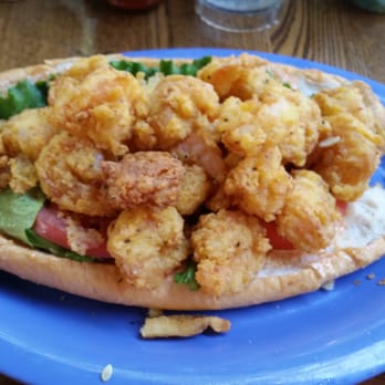 Caroline's - Shrimp po boy had to take the fries off the plate because of how big the sandwich was. Awesome! - American Near Me - Key West, Florida Caroline's - Shrimp po boy had to take the fries off the plate because of how big the sandwich was. Awesome! - American Near Me - Key West, Florida