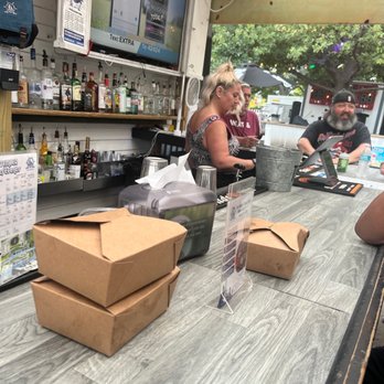 Boat Drinks - a group of people sitting at a bar - American Near Me - Chicago, Illinois