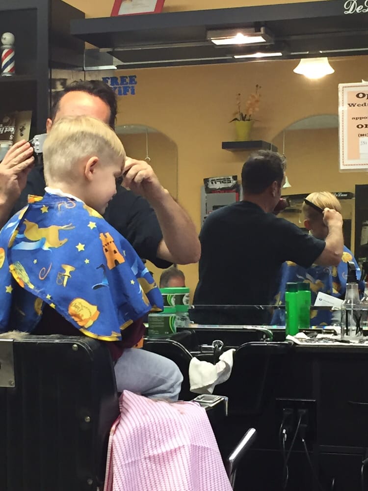 Delux Barber Shop Logo