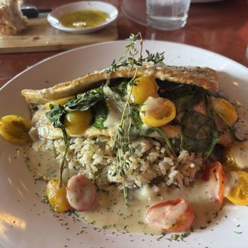 Fork And Vine - Deboned trout fillets stuffed with risotto, spinach, and tomato. - Italian Near Me - Lenoir City, Tennessee Fork And Vine - Deboned trout fillets stuffed with risotto, spinach, and tomato. - Italian Near Me - Lenoir City, Tennessee