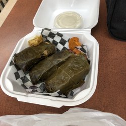 Kabobgy - 3 grape leaves appetizer- peel back the paper to reveal some bonus potatoes and pickled turnips!