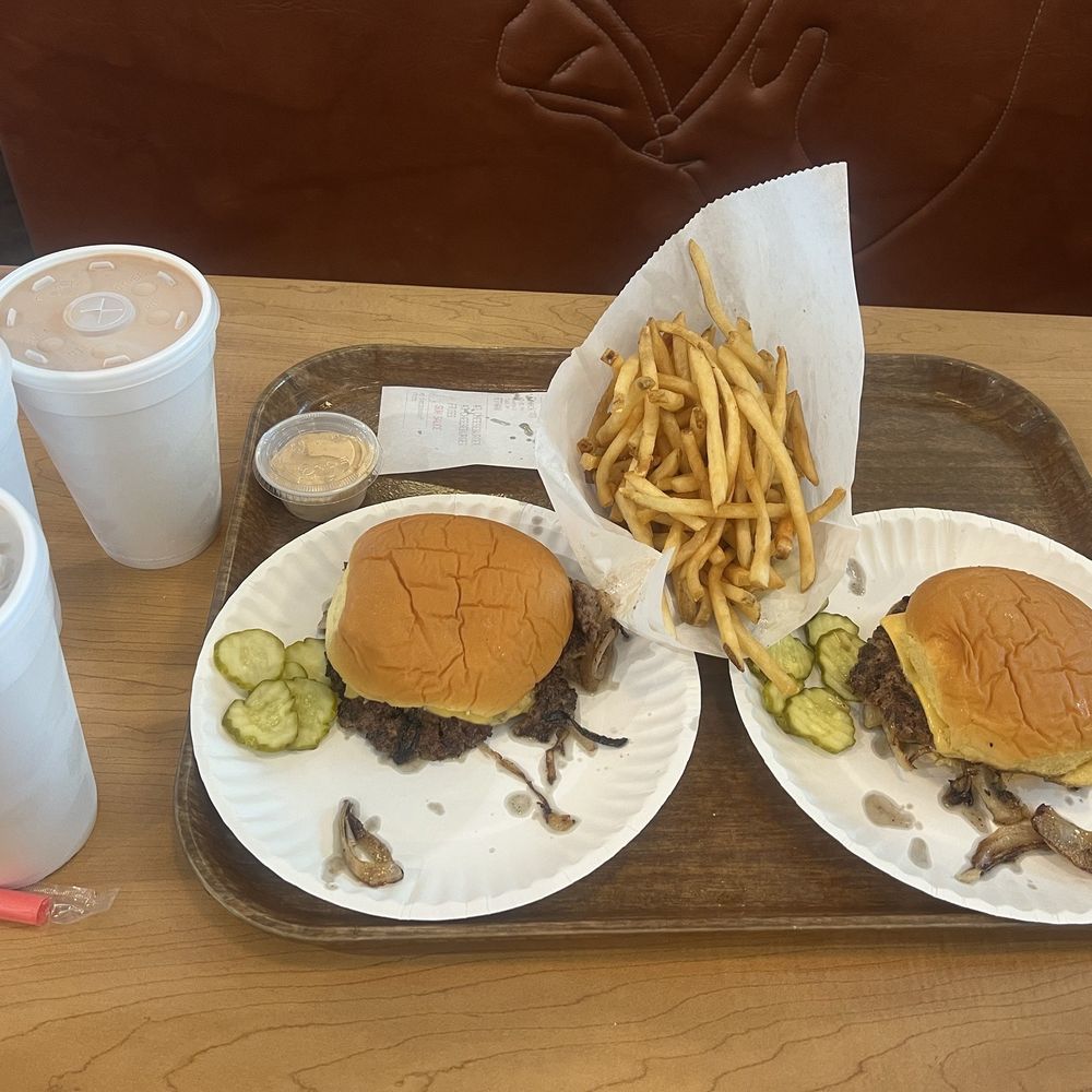 Cheeseburgers with fries and fountain drinks Cheeseburgers with fries and fountain drinks
