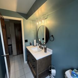 Handy & Co - Replaced tile where old built in vanity with customer supplied tiles that looked very close to the original