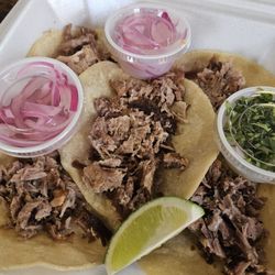 King's Tacos - Carnitas Tacos, pickled red onions, chopped white onions with cilantro, lime wedge.