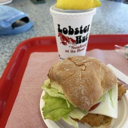 Fried fish Sandwich and an ice tea. Fried fish Sandwich and an ice tea.