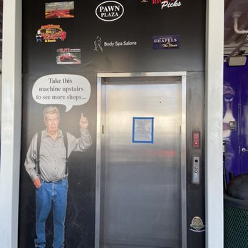 Chumlees Candy On The Blvd - Graphics of "The Old Man" (Rick's Dad) next to the elevator doors on the building. - Candy Stores Near Me - Las Vegas, Nevada Chumlees Candy On The Blvd - Graphics of "The Old Man" (Rick's Dad) next to the elevator doors on the building. - Candy Stores Near Me - Las Vegas, Nevada