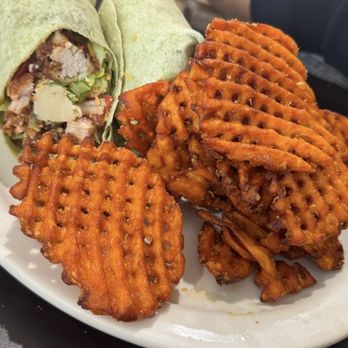 Kristof's Kafe - Chicken Caesar Wrap with Waffle sweet potato fries. - American Near Me - Davie, Florida Kristof's Kafe - Chicken Caesar Wrap with Waffle sweet potato fries. - American Near Me - Davie, Florida